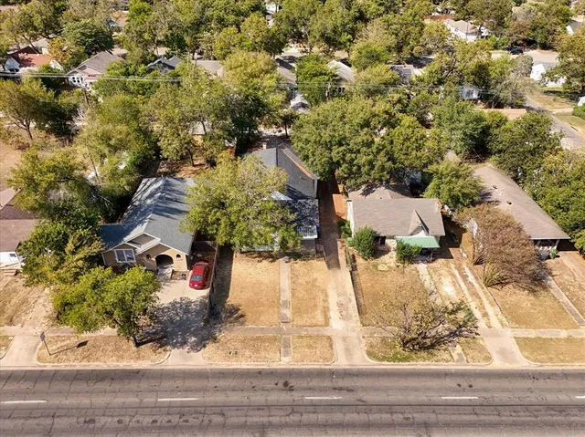 an aerial view of residential houses with outdoor space