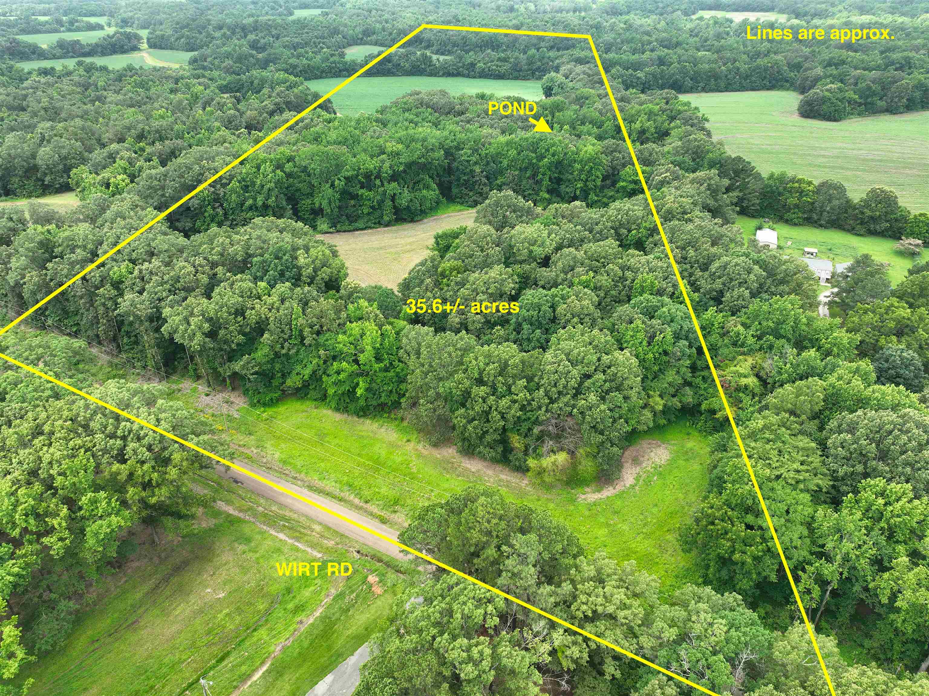2265 Wirt Road Oakland, TN 38060 - Photo 1 of 24 Aerial view of sparsely populated area with property parcel outlined and a heavily wooded area