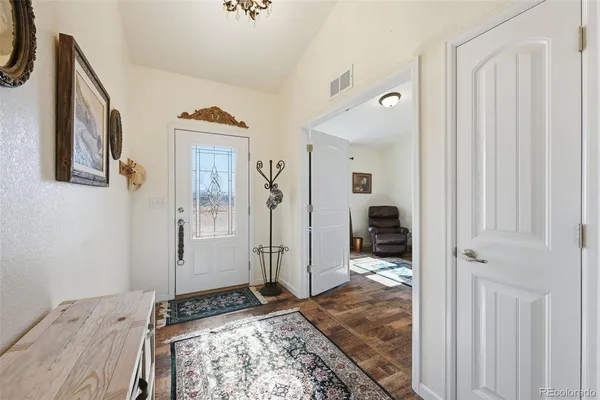 a view of a storage and utility room with closet
