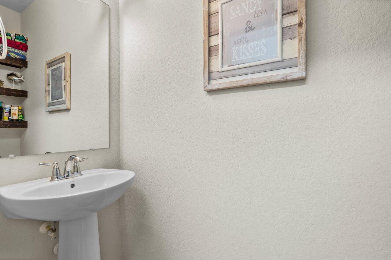 1311 Community Drive Jupiter, FL 33458 - Photo 20 of 32 half bath downstairs