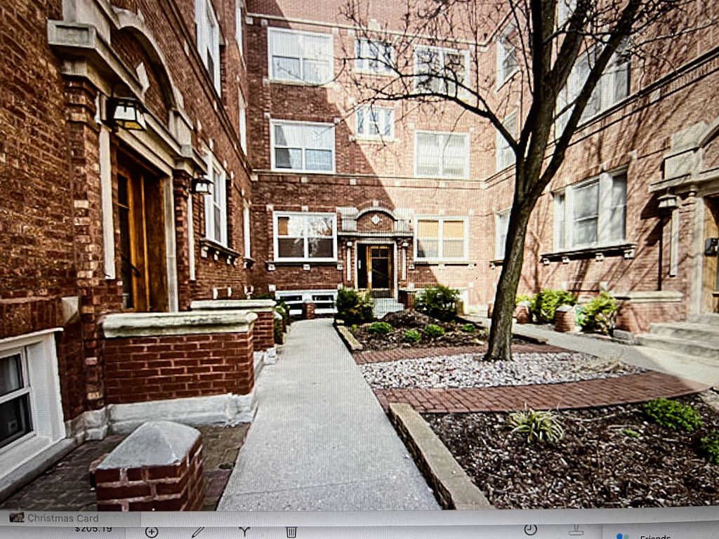 4446 North Beacon Street, Unit 3 Chicago, IL 60640 - Photo 12 of 13 a wooden bench sitting in front of a building