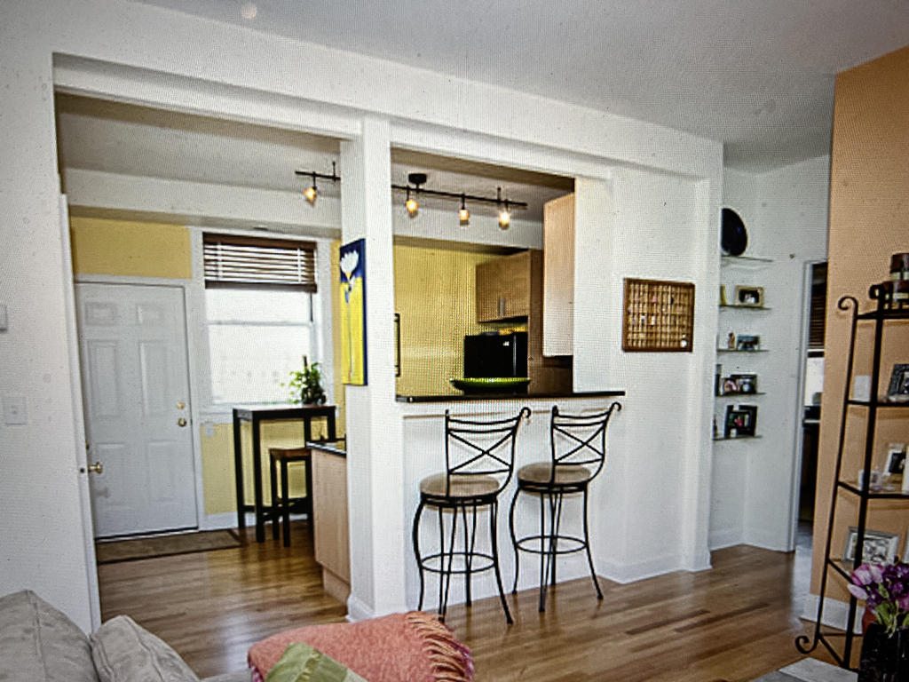 4446 North Beacon Street, Unit 3 Chicago, IL 60640 - Photo 3 of 13 a view of a dining room with furniture and wooden floor