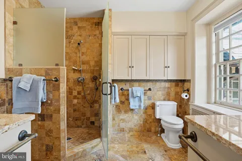 a bathroom with a sink a mirror and vanity
