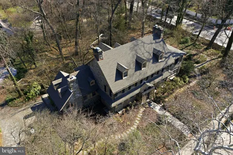a view of a large building with a yard