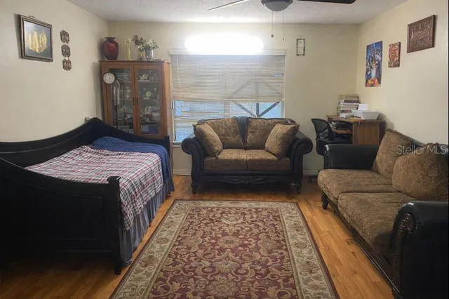 a bedroom with a bed and a couch