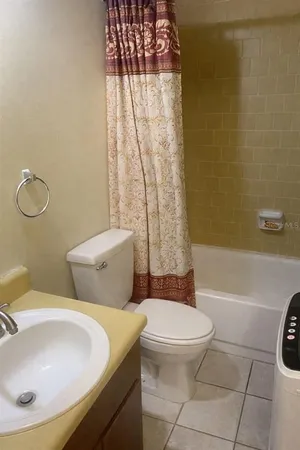 a bathroom with a toilet and a sink