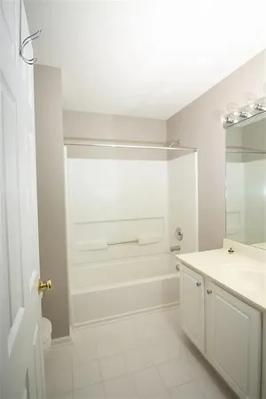a bathroom with a bathtub and a sink