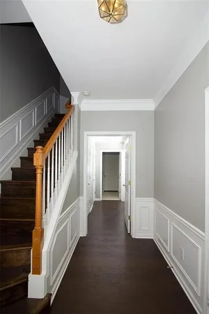 a view of an entryway with wooden floor
