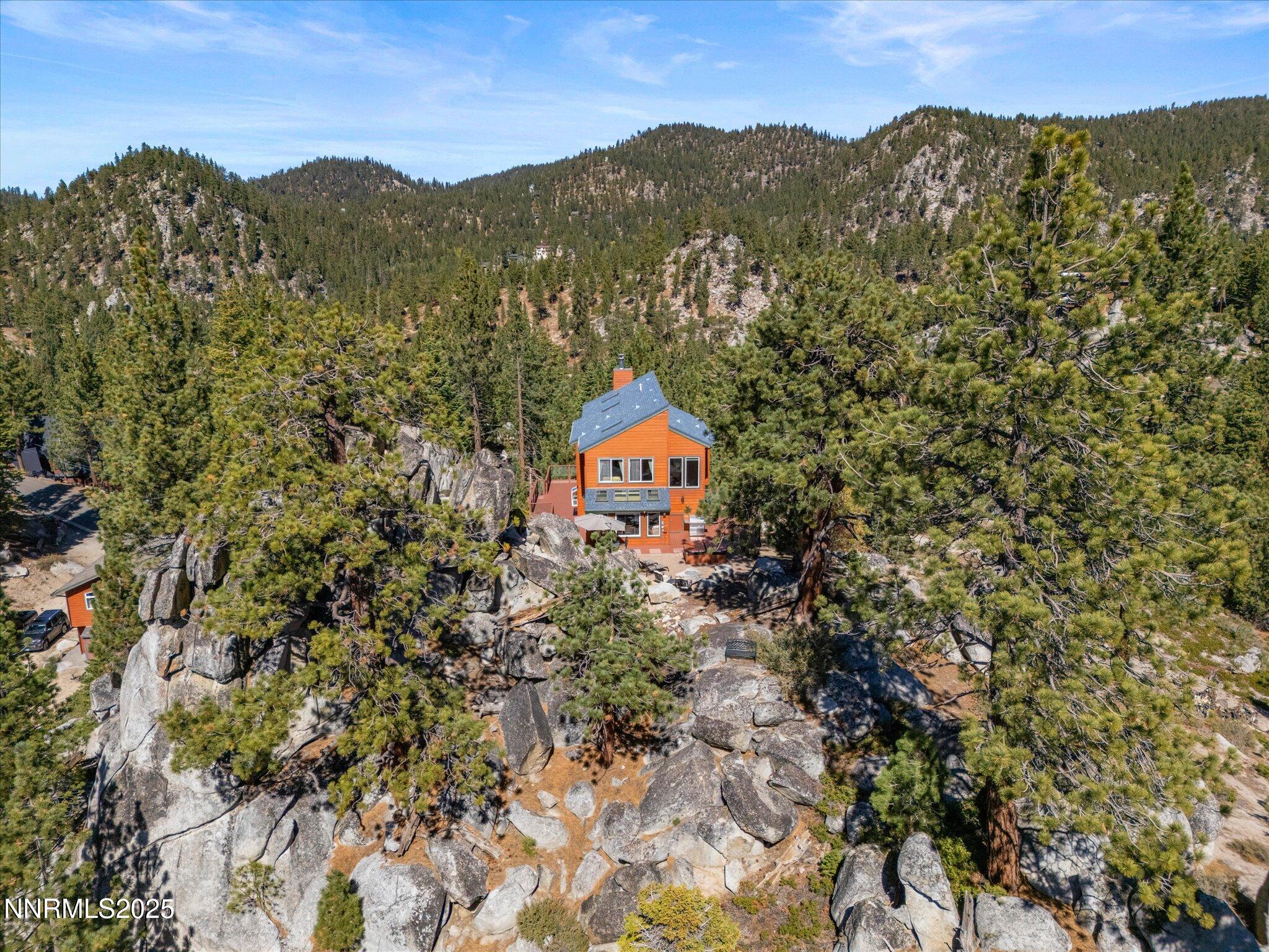 689 Tina Court Stateline, NV 89449 - Photo 13 of 102 a view of a mountain with a mountain in the background