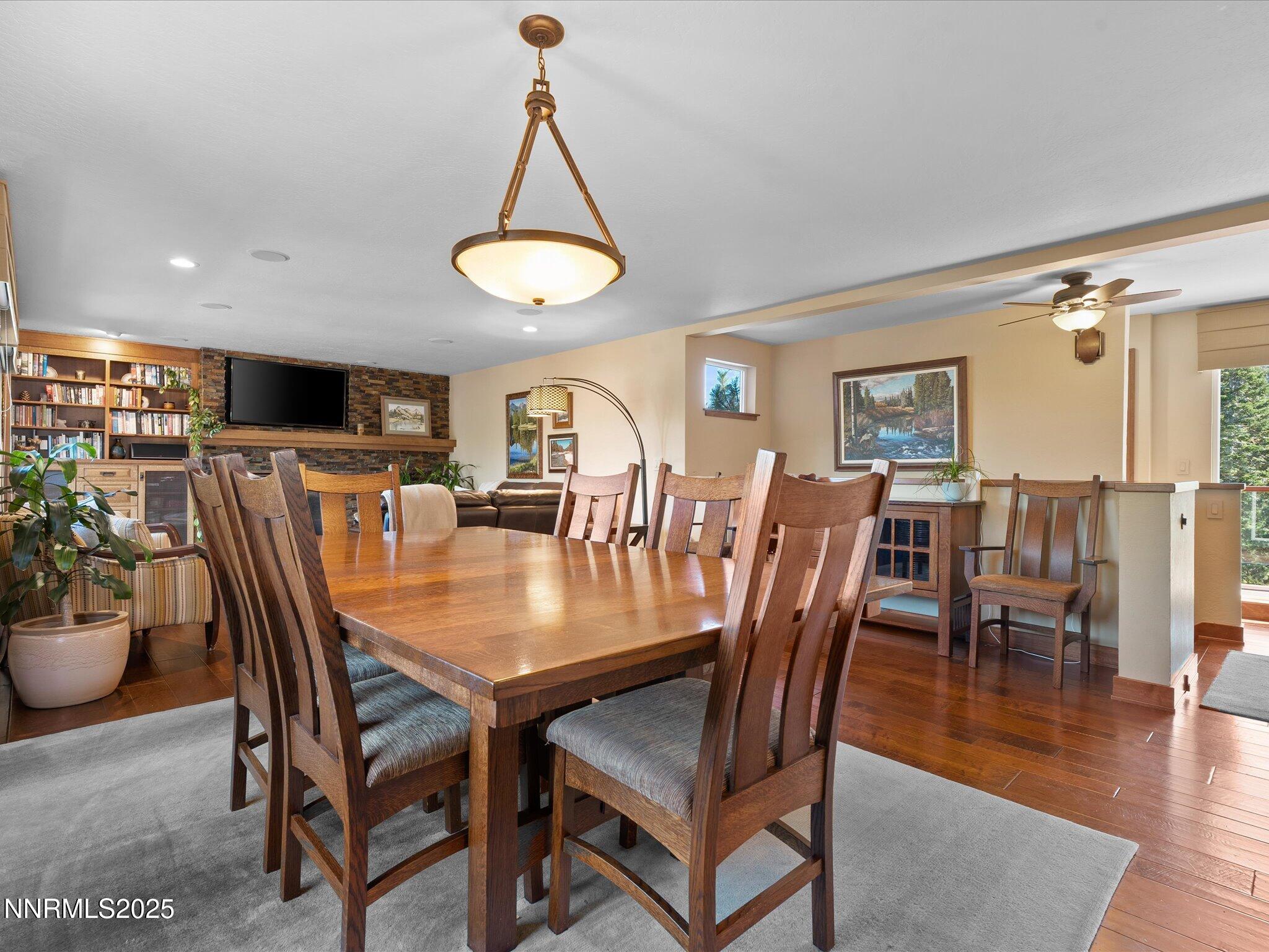 689 Tina Court Stateline, NV 89449 - Photo 26 of 102 a view of a dining room with furniture window and wooden floor