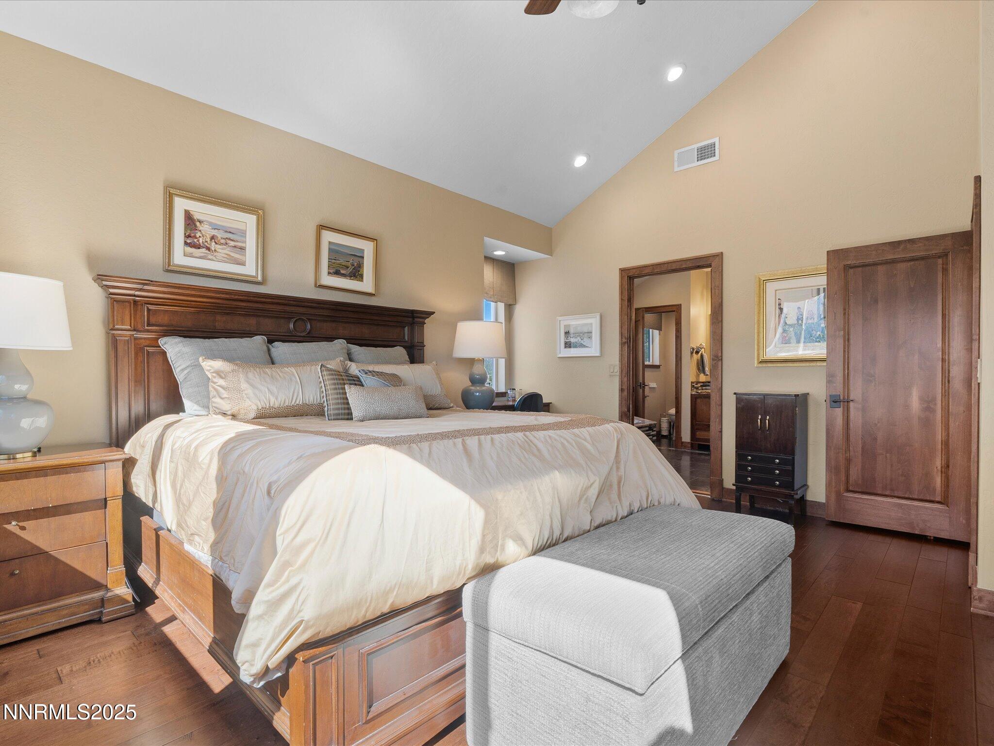 689 Tina Court Stateline, NV 89449 - Photo 40 of 102 a bedroom with bed and wooden floor