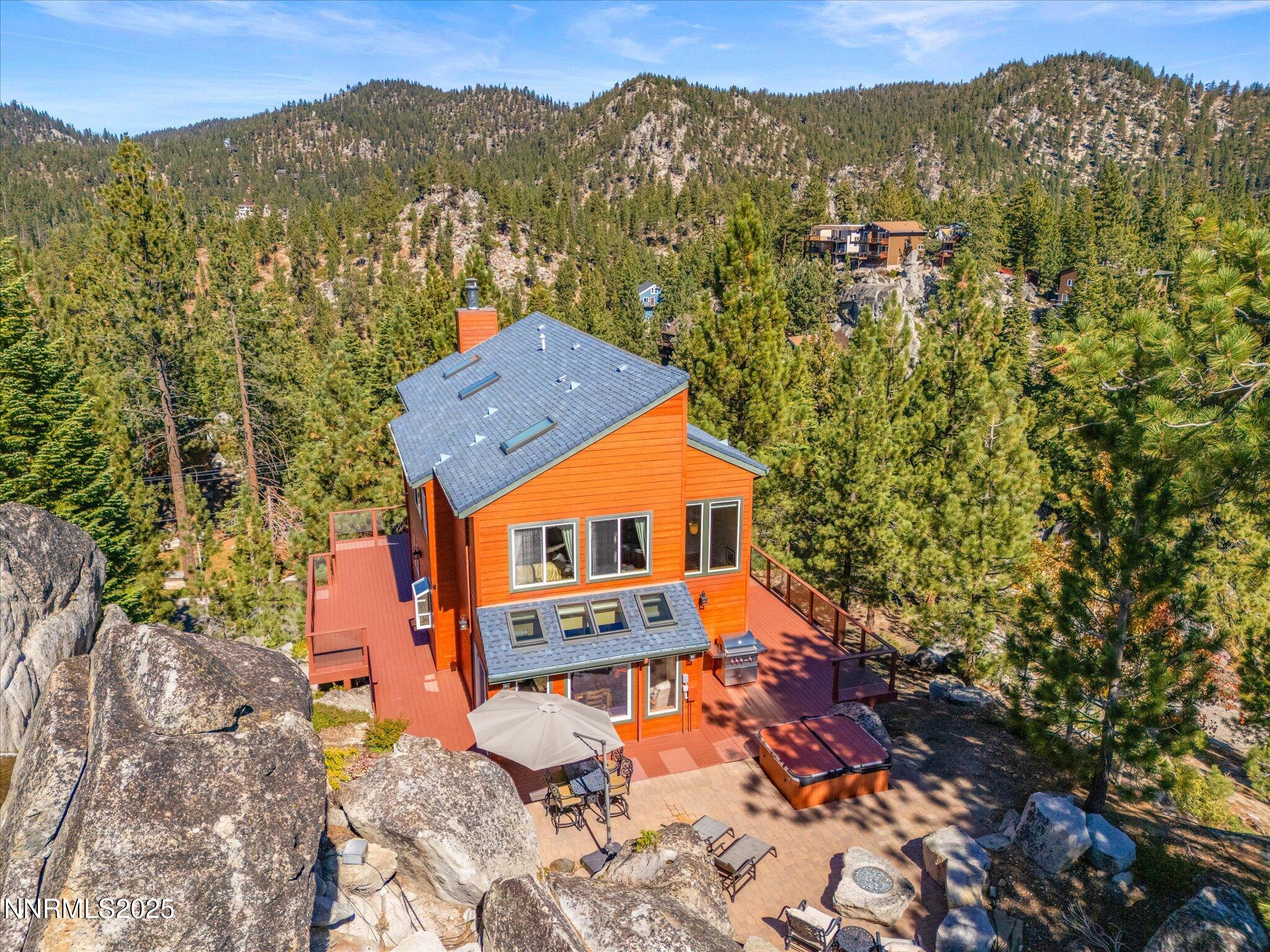 689 Tina Court Stateline, NV 89449 - Photo 4 of 102 an aerial view of a house with a mountain