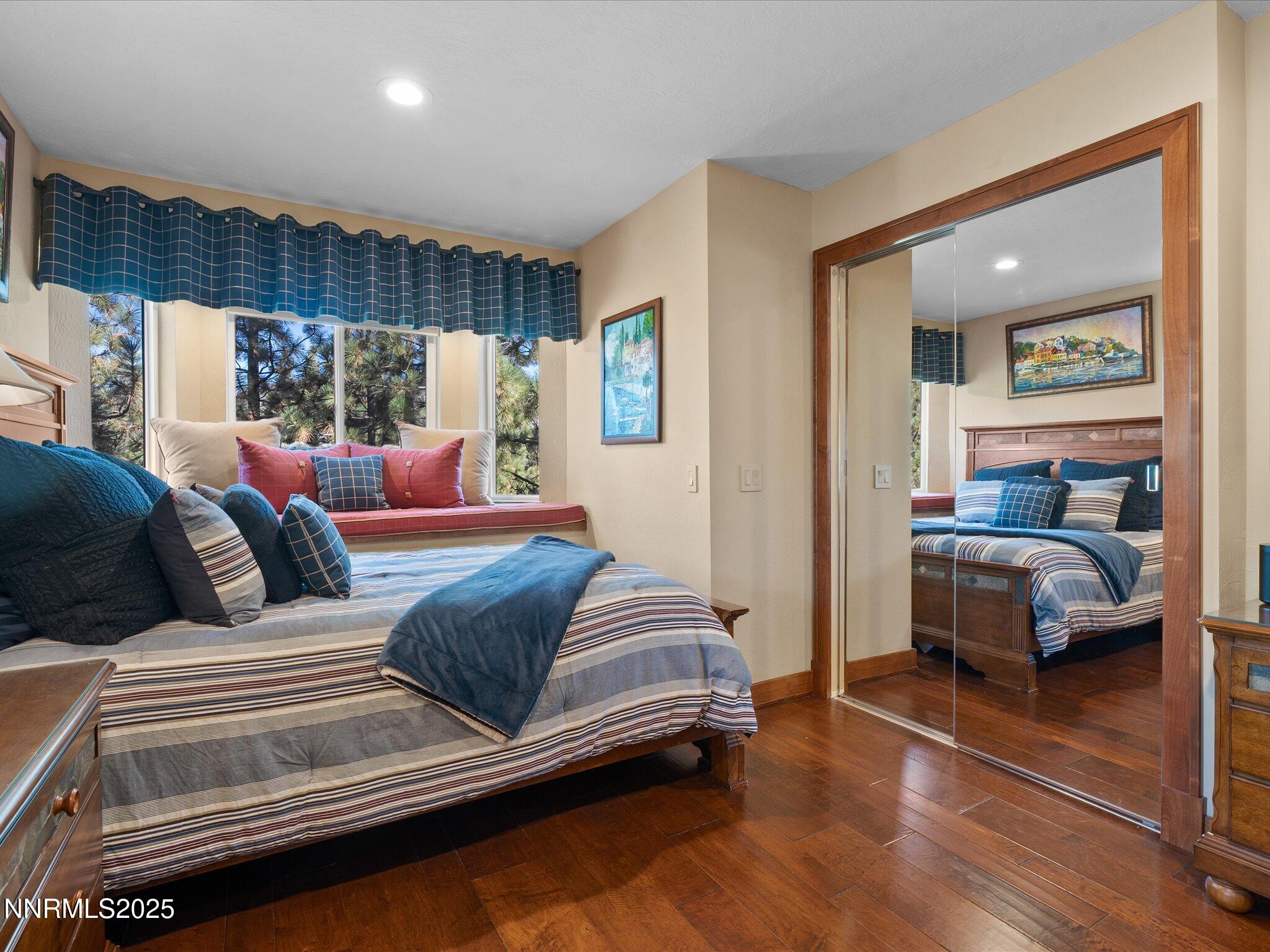 689 Tina Court Stateline, NV 89449 - Photo 49 of 102 a bedroom with bed and a large window