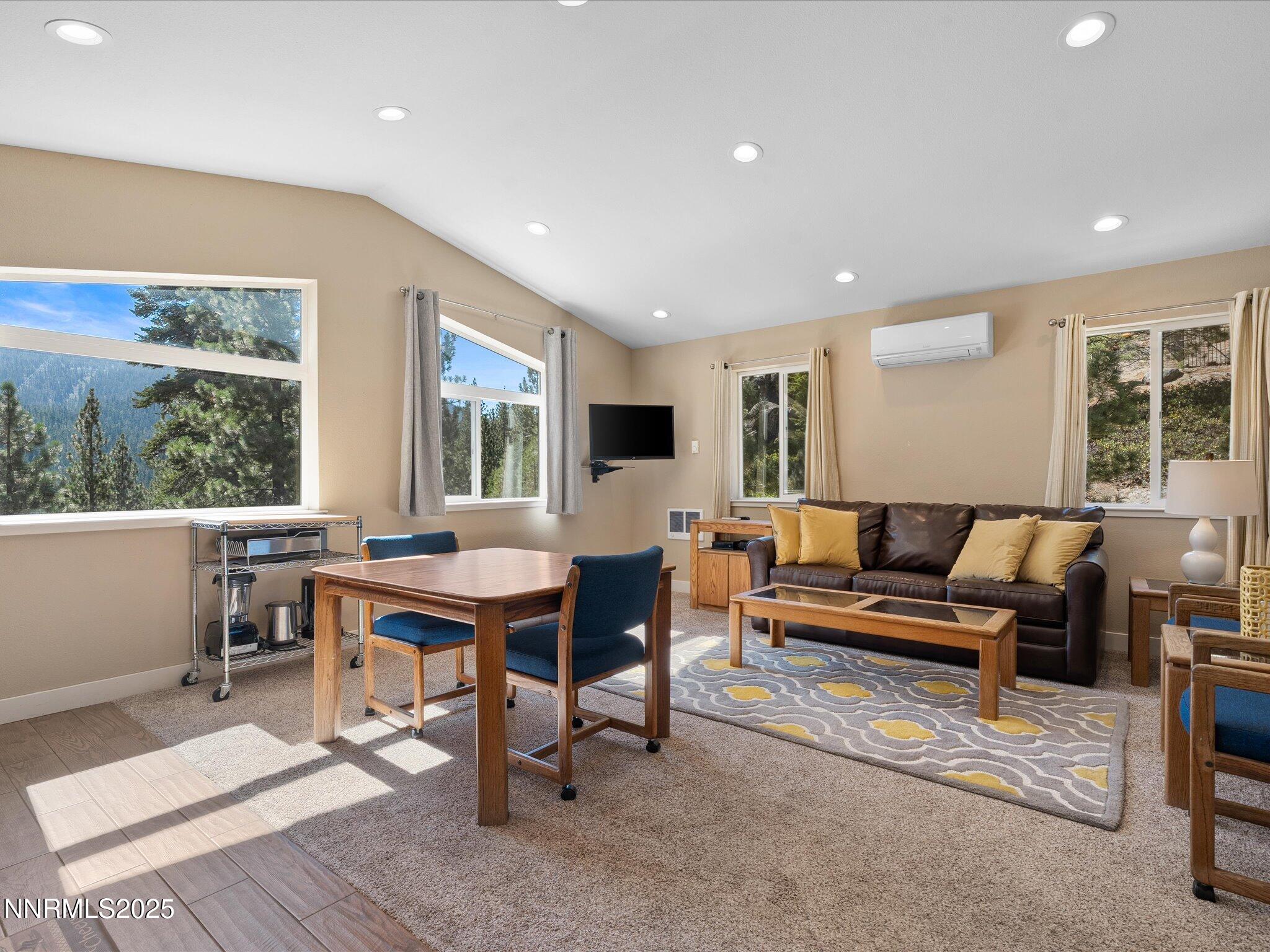 689 Tina Court Stateline, NV 89449 - Photo 76 of 102 a living room with furniture a large window and table