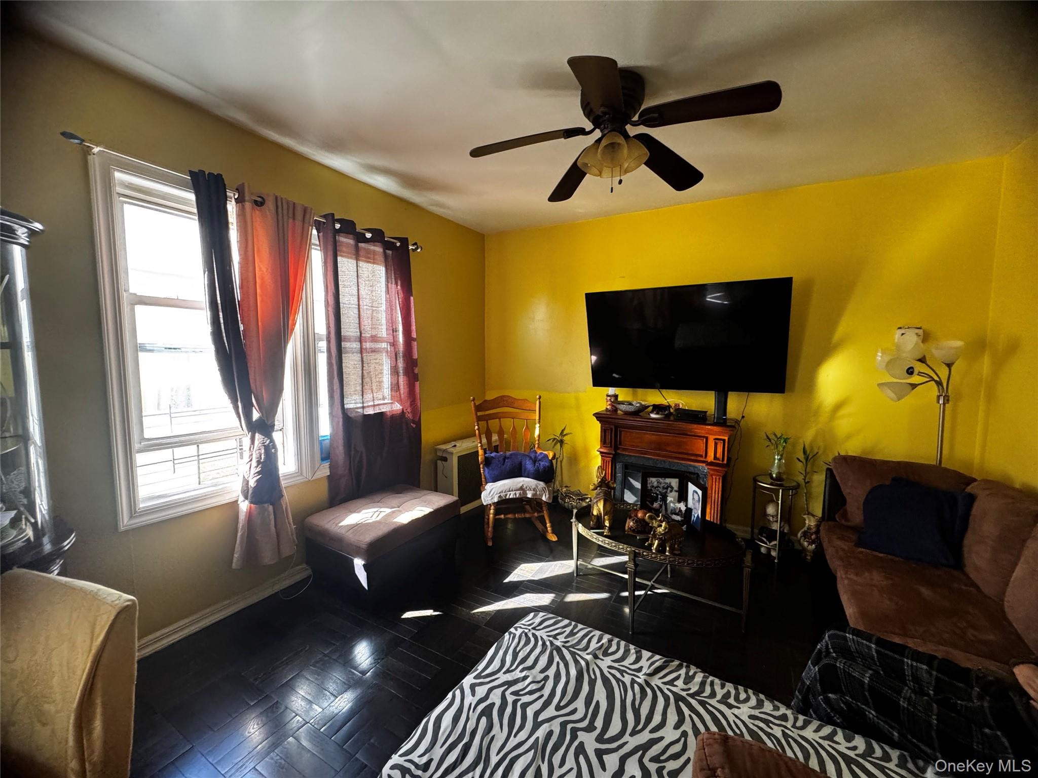 97-40 Corona Avenue Queens, NY 11368 - Photo 6 of 7 a living room with furniture and a flat screen tv