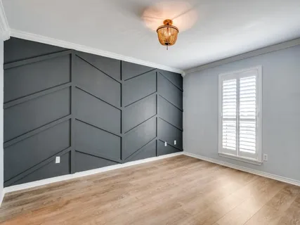 an empty room with a empty space and window