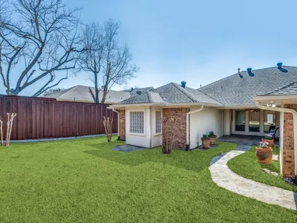 a view of a house with a yard porch and sitting area