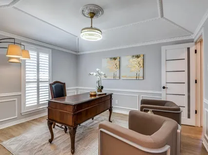 a work room with furniture and windows