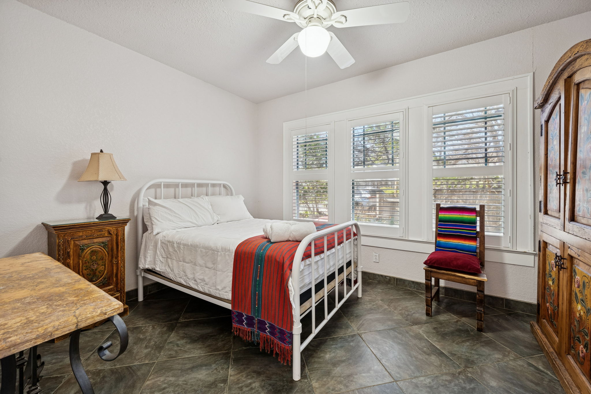 3101 Wheeler Street Austin, TX 78705 - Photo 11 of 20 a bedroom with a bed and a chandelier