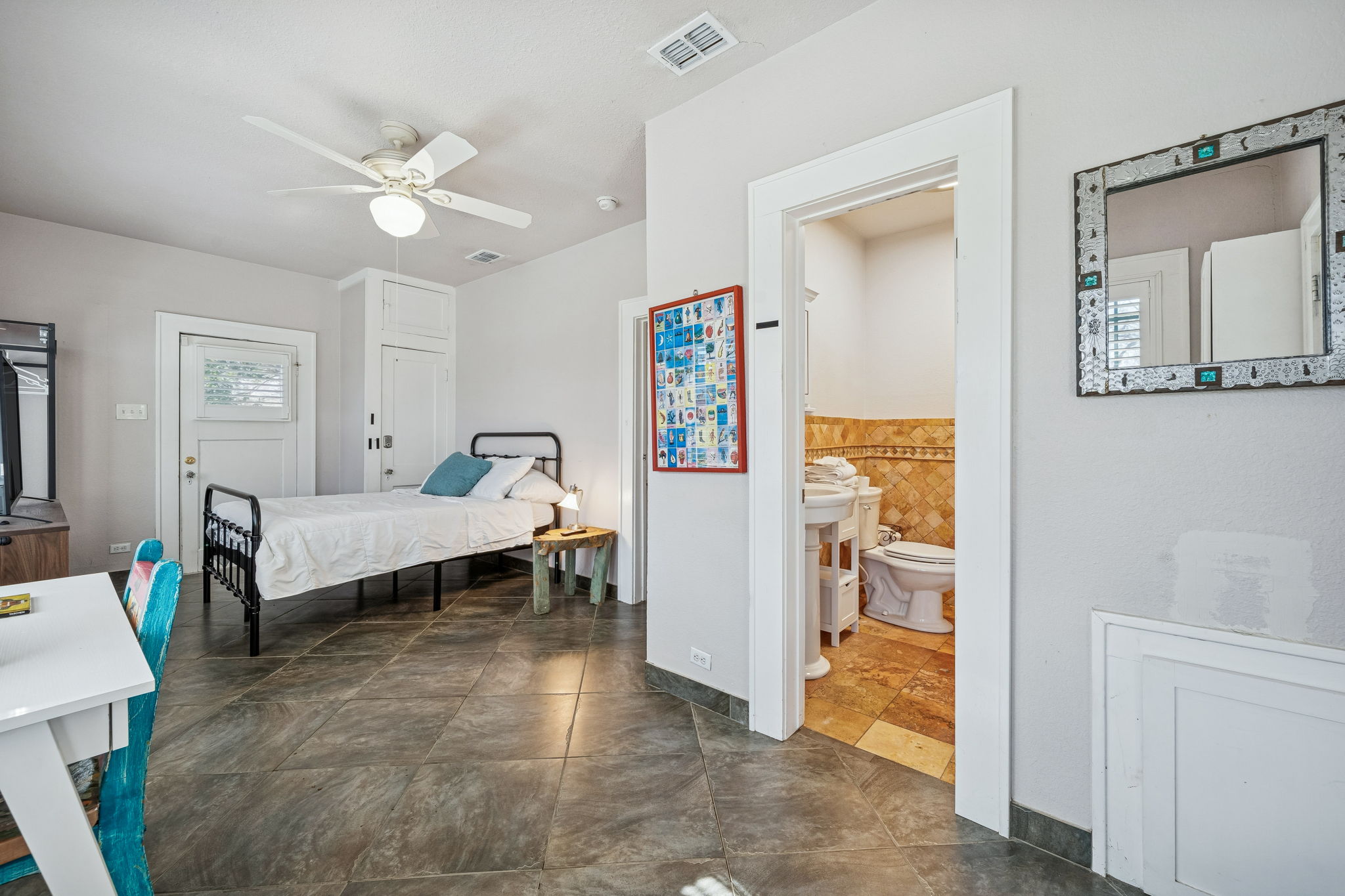 3101 Wheeler Street Austin, TX 78705 - Photo 14 of 20 a bedroom with a bed and a chandelier