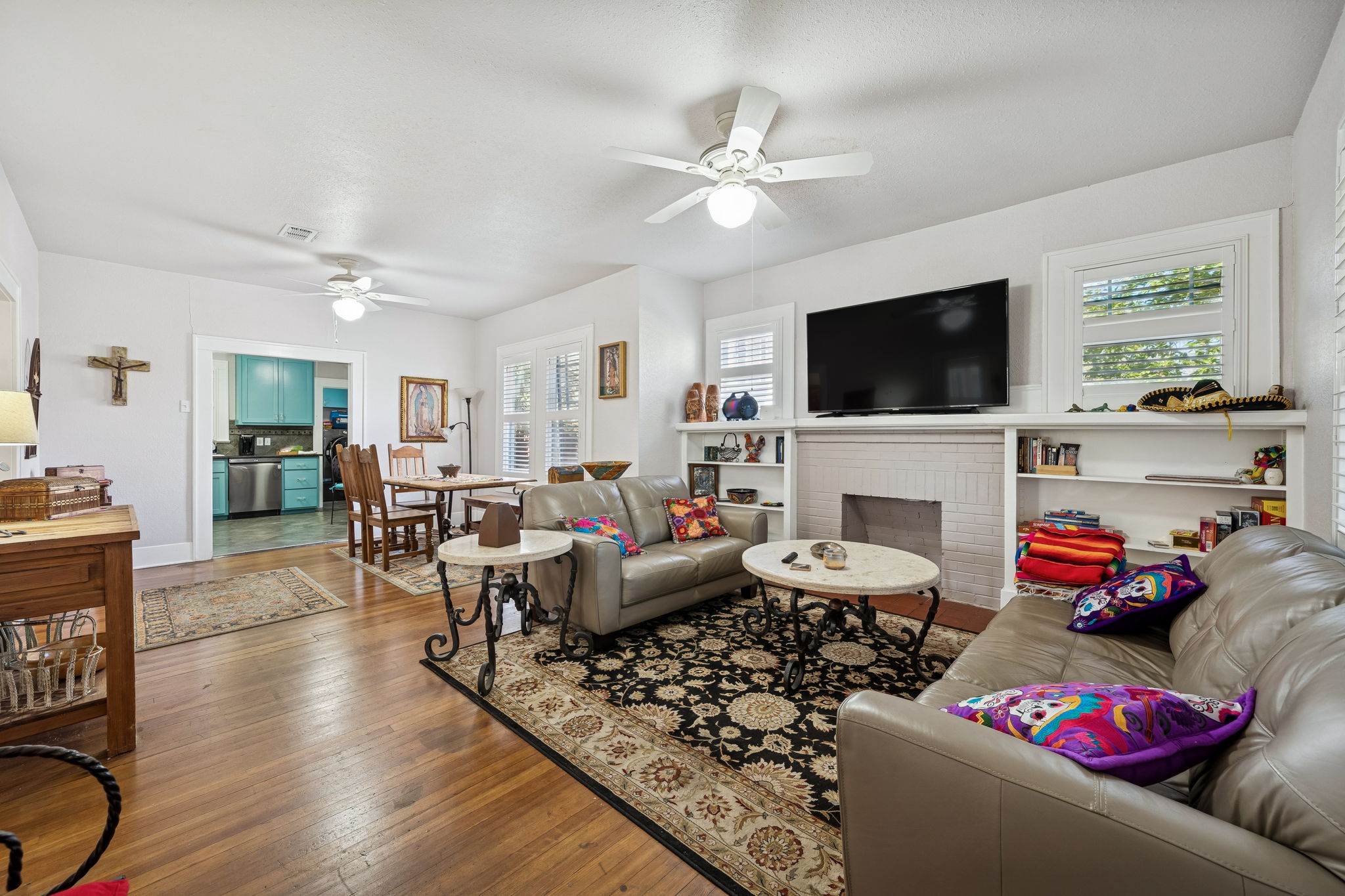 3101 Wheeler Street Austin, TX 78705 - Photo 3 of 20 a living room with furniture a flat screen tv and a fireplace