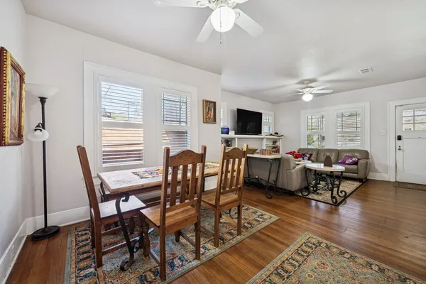 a view of a livingroom with furniture and a flat screen tv