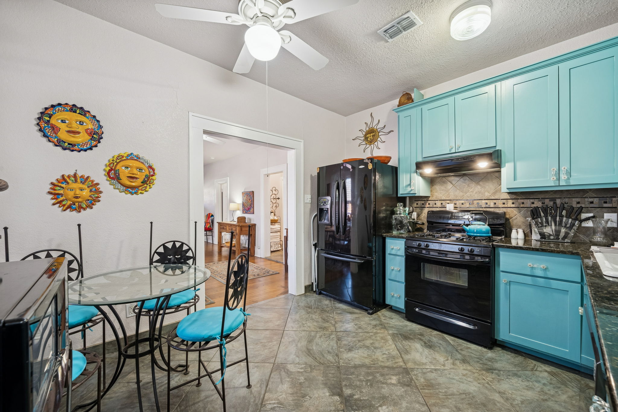 3101 Wheeler Street Austin, TX 78705 - Photo 7 of 20 a kitchen with stainless steel appliances granite countertop a refrigerator and a stove top oven