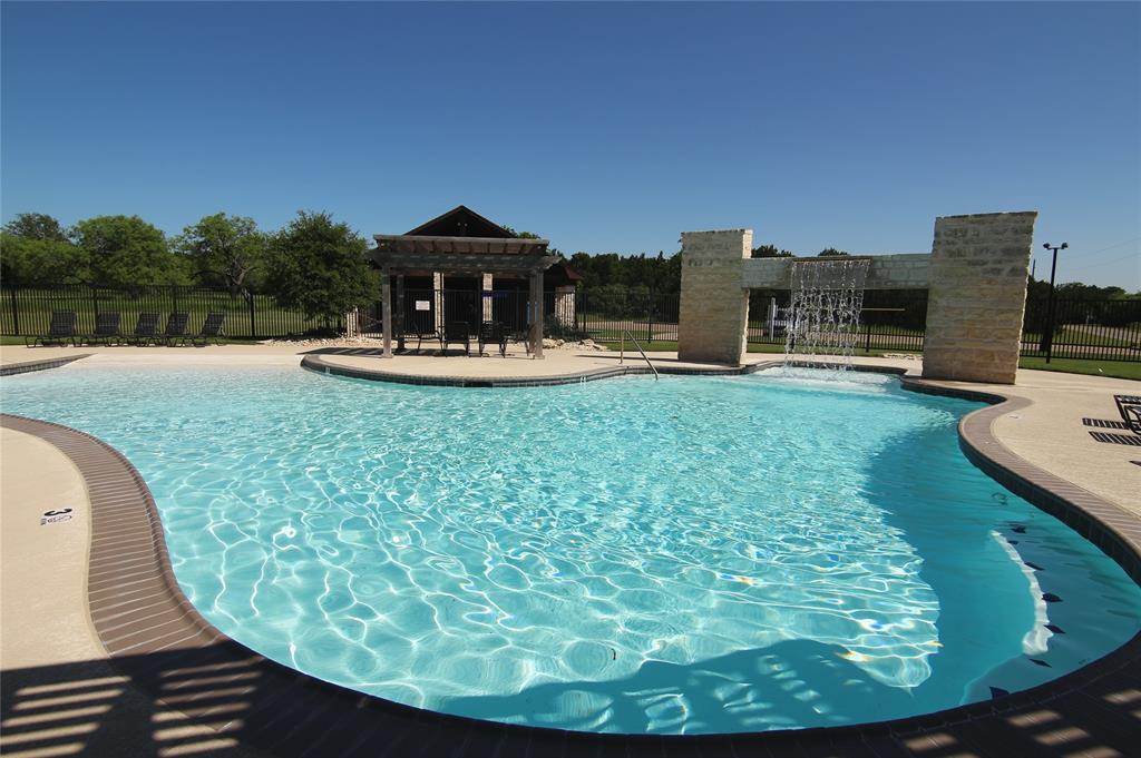 1377 Spring Valley Trail Whitney, TX 76692 - Photo 24 of 34 a view of a swimming pool with a back yard