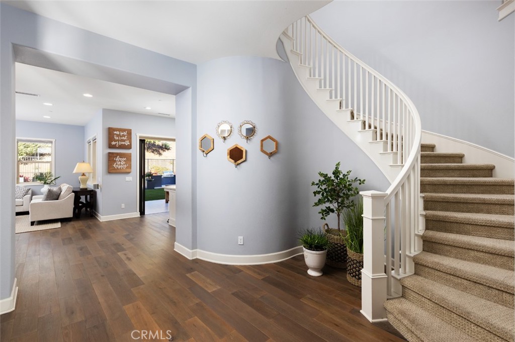 a view of entryway with livingroom and wooden floor