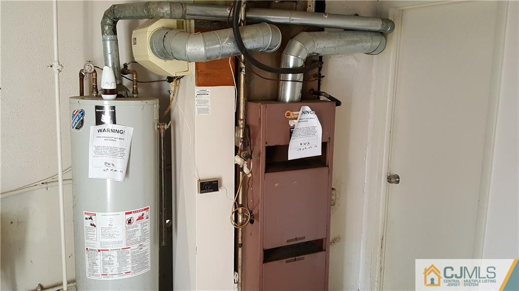 767 Magnolia Road North Brunswick, NJ 08902 - Photo 15 of 15 a close view of water heater room