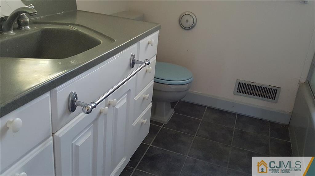 767 Magnolia Road North Brunswick, NJ 08902 - Photo 7 of 15 a bathroom with a toilet and a sink