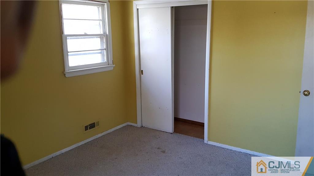 767 Magnolia Road North Brunswick, NJ 08902 - Photo 9 of 15 an empty room with windows