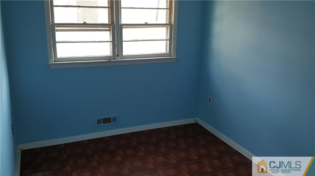 767 Magnolia Road North Brunswick, NJ 08902 - Photo 10 of 15 an empty room with a window