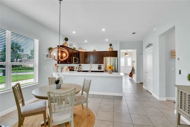 a kitchen with a table and chairs in it