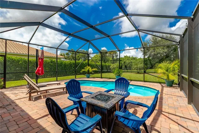 a sitting area with furniture and umbrella