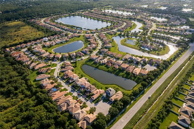 an aerial view of a residential houses with outdoor space