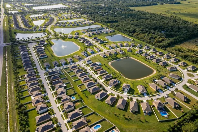 an aerial view of a house with a swimming pool