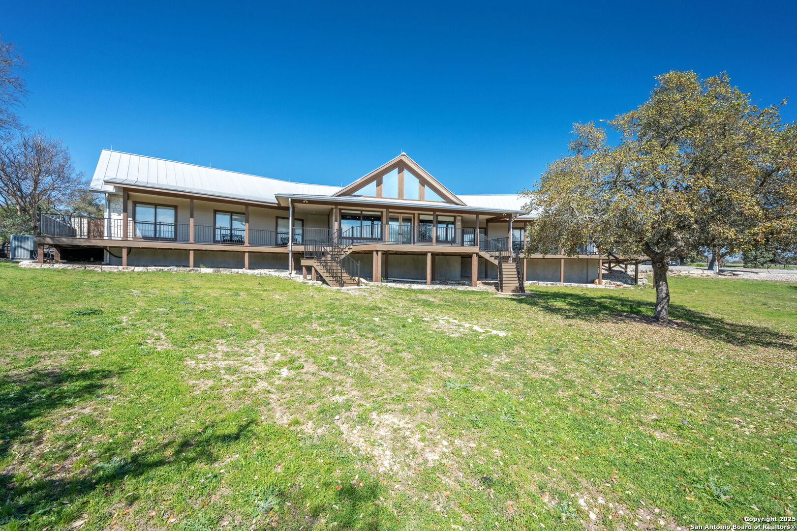 365 River Cliff Place Spring Branch, TX 78070 - Photo 11 of 48 a front view of a house with a yard