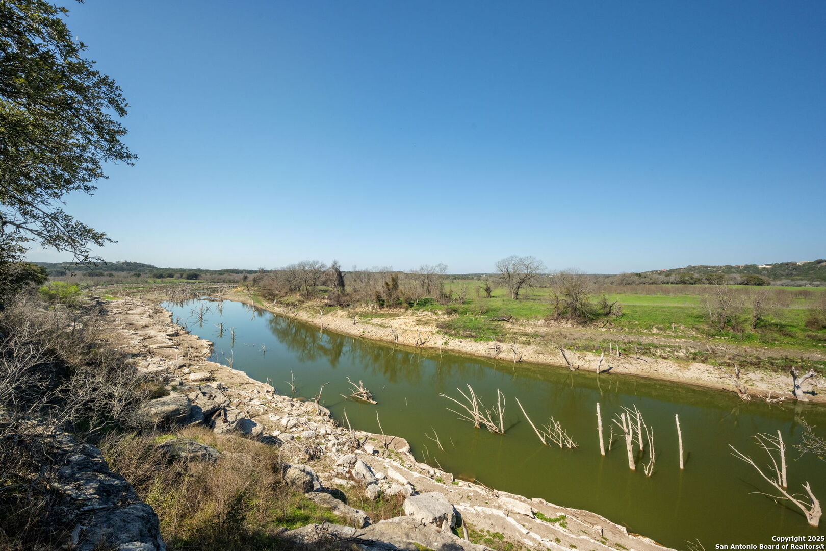 365 River Cliff Place Spring Branch, TX 78070 - Photo 17 of 48 a view of a lake with houses in the back