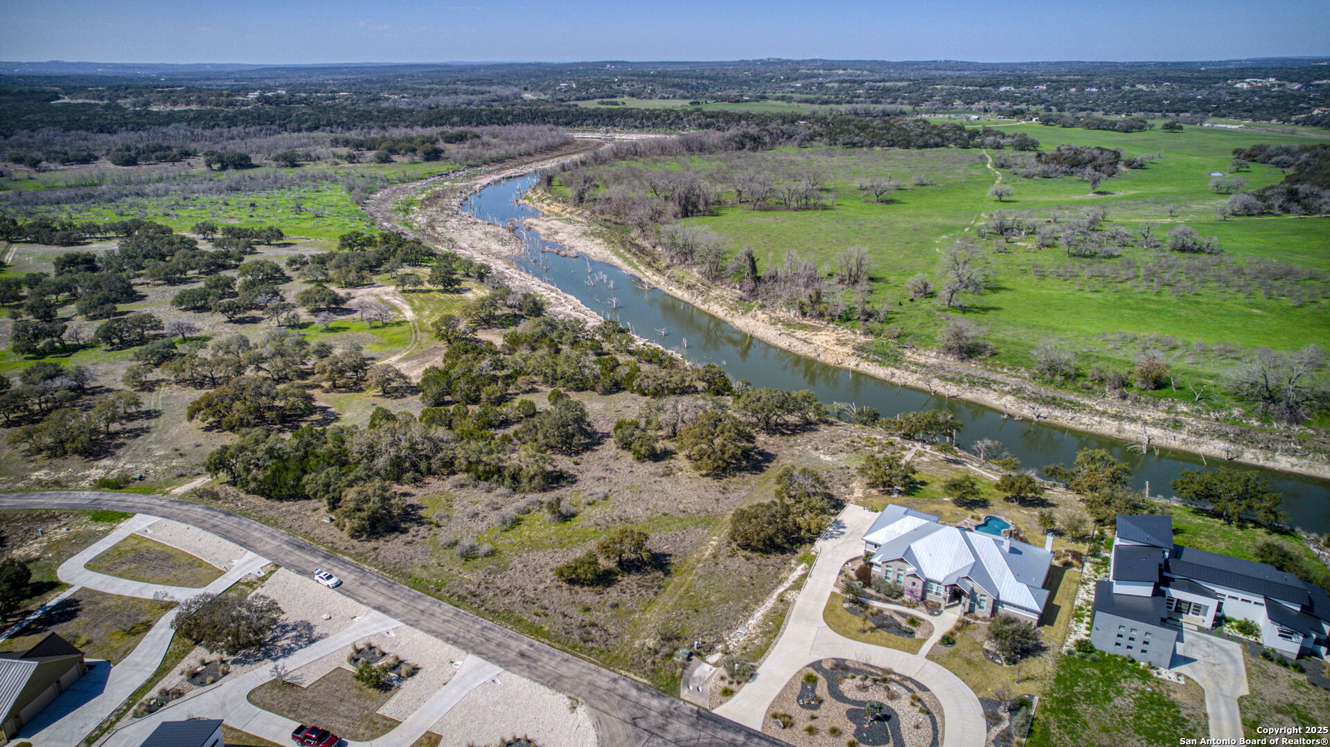 365 River Cliff Place Spring Branch, TX 78070 - Photo 29 of 48 an aerial view of a house with a yard