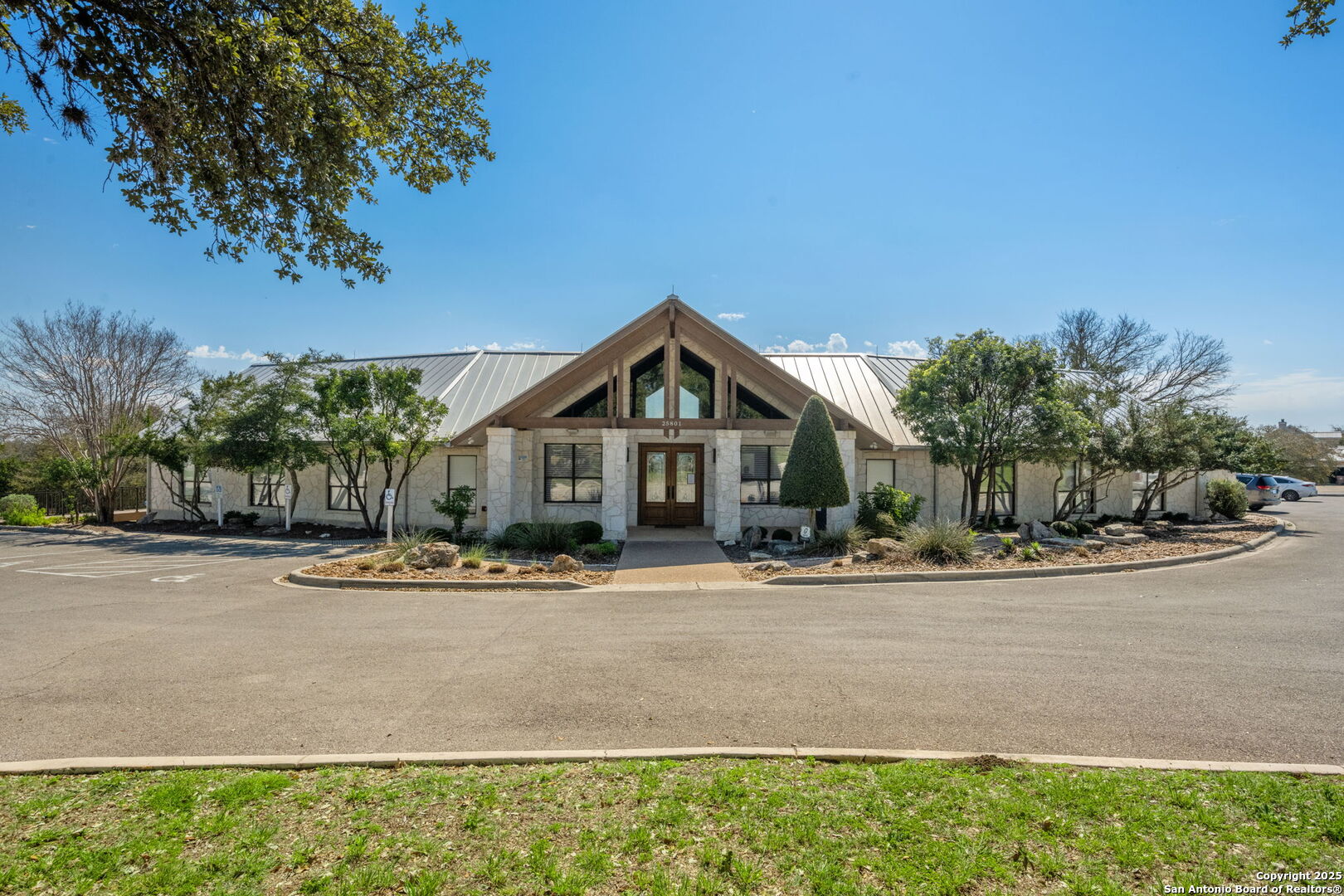 365 River Cliff Place Spring Branch, TX 78070 - Photo 4 of 48 a front view of a house with a yard and garage