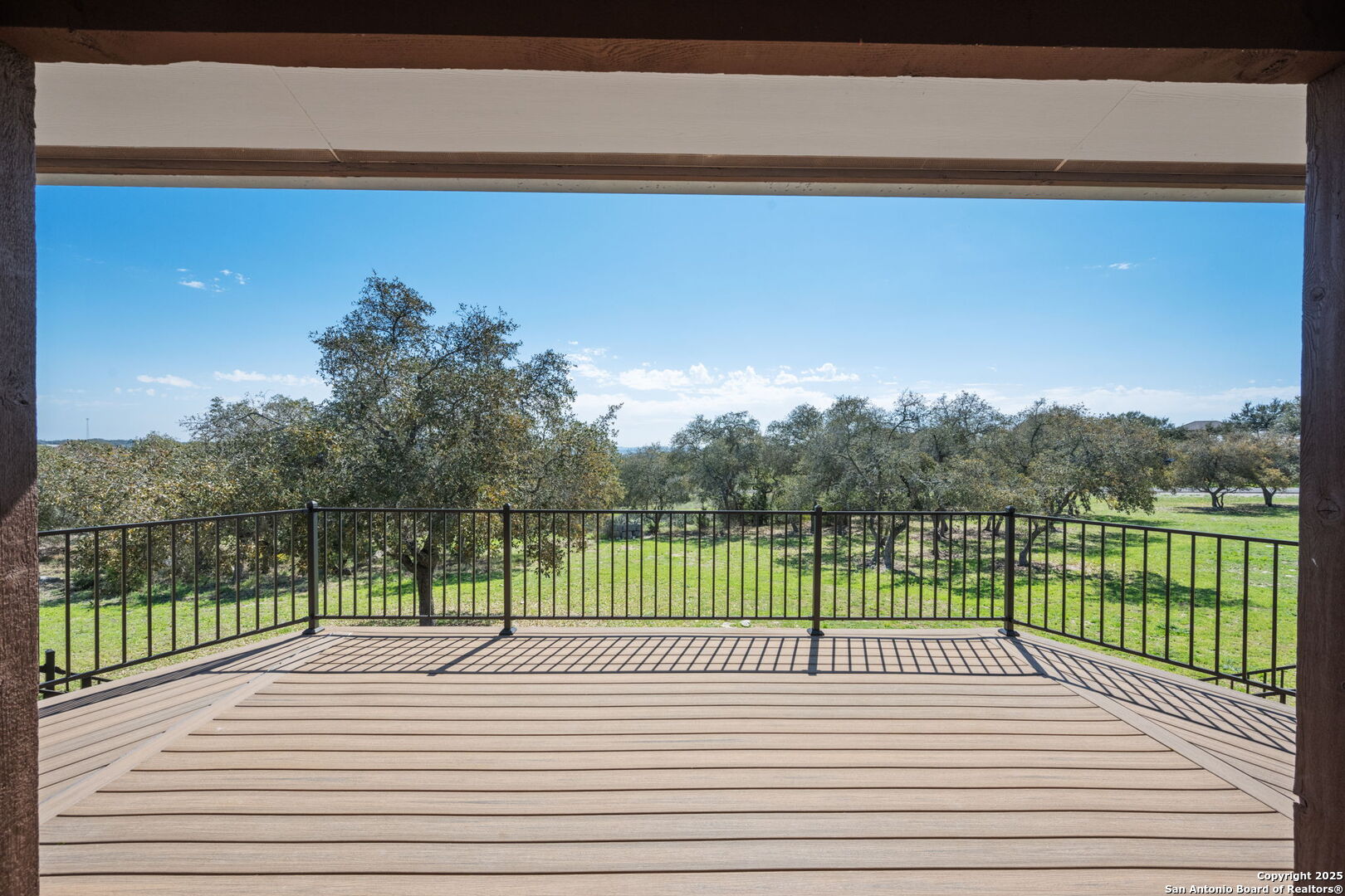 365 River Cliff Place Spring Branch, TX 78070 - Photo 9 of 48 a view of balcony with wooden floor and fence