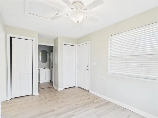 a view of an empty room with a bathroom