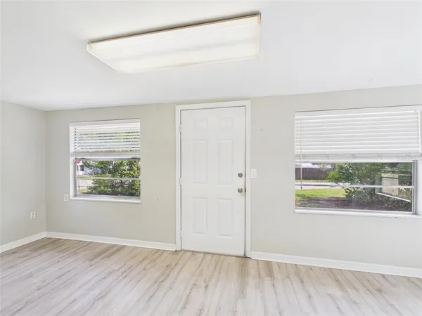 a view of an empty room with a window