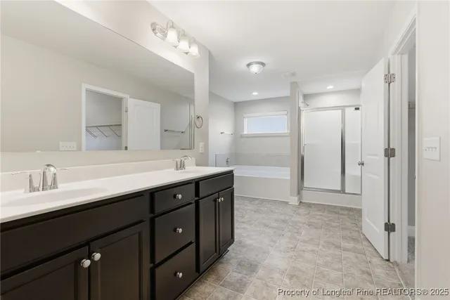 a bathroom with a double vanity sink mirror and shower