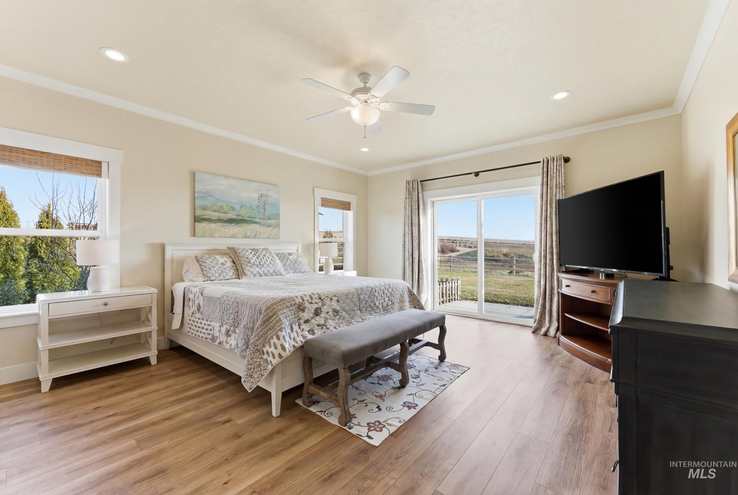 5800 Partridge Peak Avenue Caldwell, ID 83607 - Photo 17 of 50 Bedroom with access to outside, crown molding, light wood-type flooring, ceiling fan, and recessed lighting