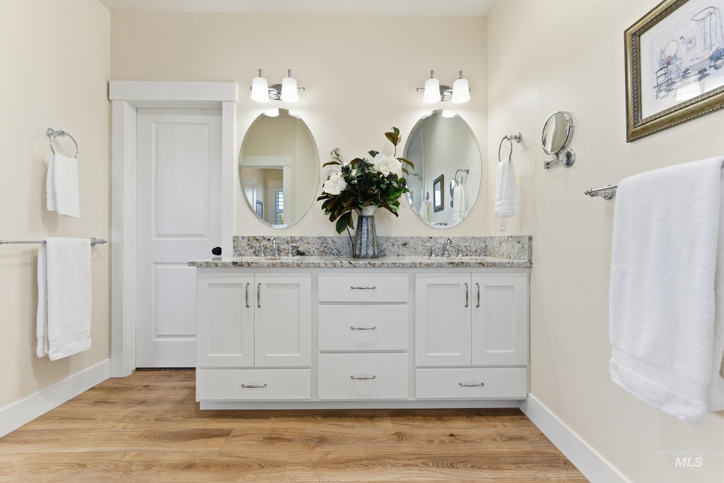 5800 Partridge Peak Avenue Caldwell, ID 83607 - Photo 21 of 50 Bathroom featuring double vanity and light wood finished floors