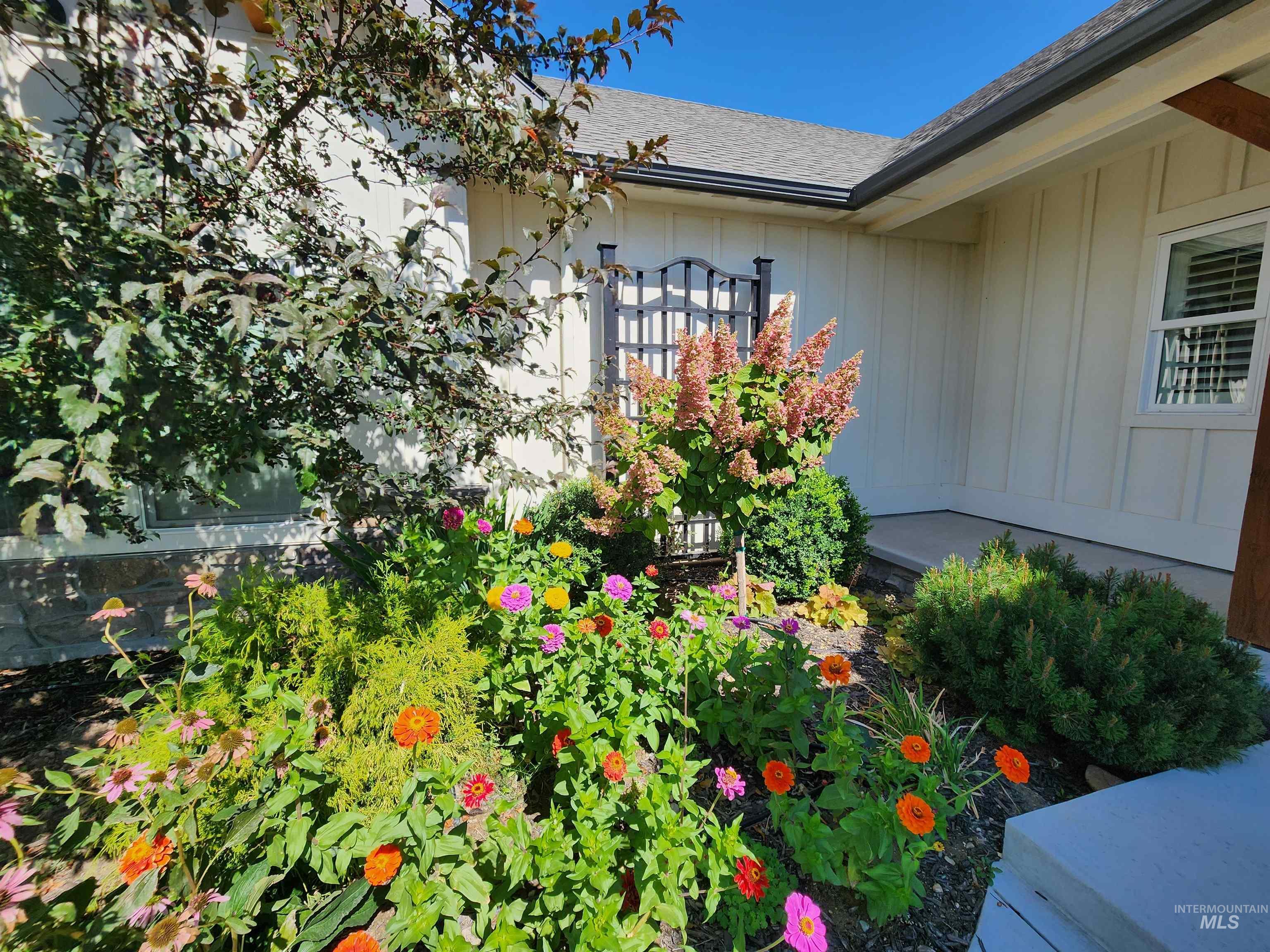 5800 Partridge Peak Avenue Caldwell, ID 83607 - Photo 42 of 50 Exterior view of board and batten siding and roof with shingles