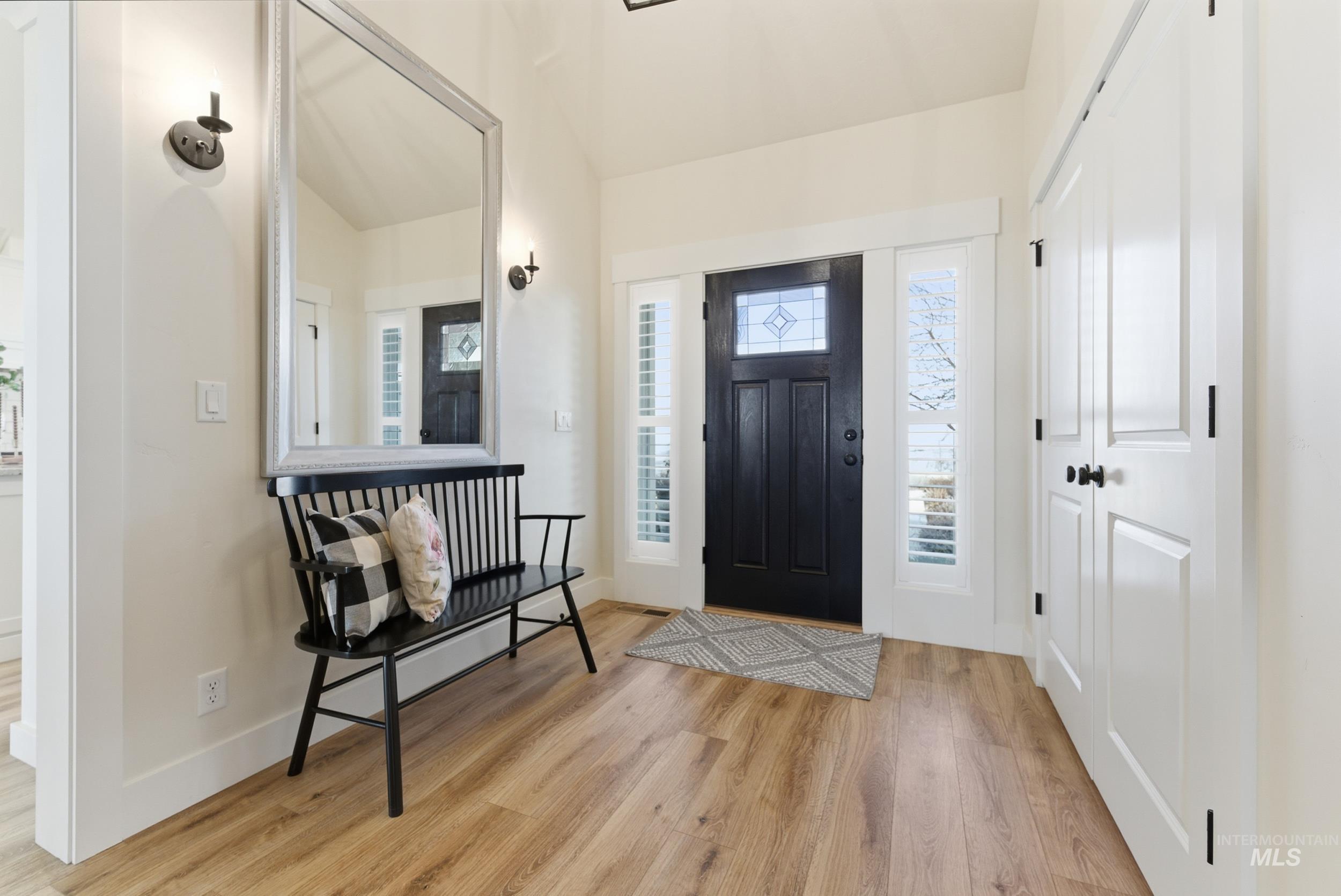5800 Partridge Peak Avenue Caldwell, ID 83607 - Photo 5 of 50 Foyer with light wood-style floors and vaulted ceiling