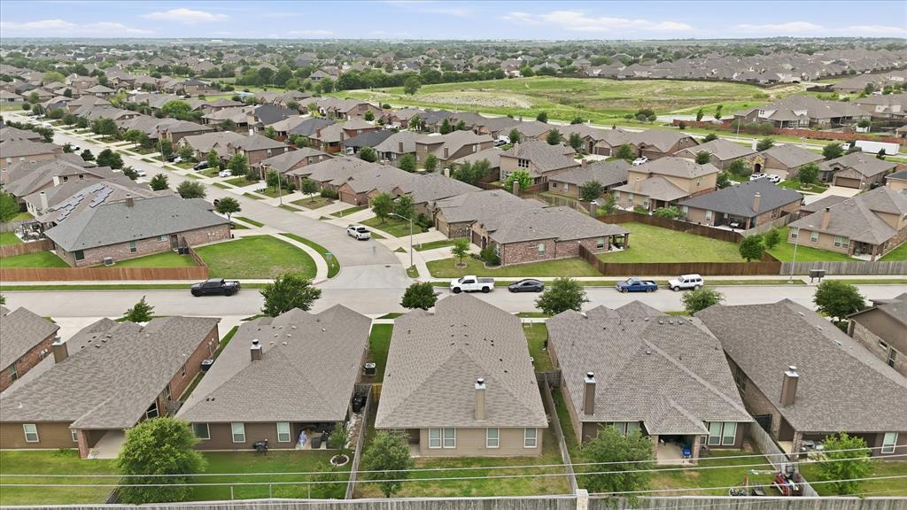 11500 Starlight Ranch Fort Worth, TX 76052 - Photo 35 of 40 Aerial view showcasing the residential community with numerous properties featuring varied rooflines and a cohesive architectural style